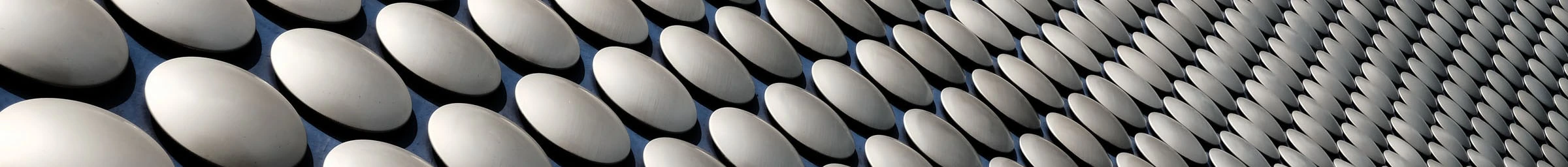 Detailed photograph of the circular cladding on the Birmingham Bullring shopping center.