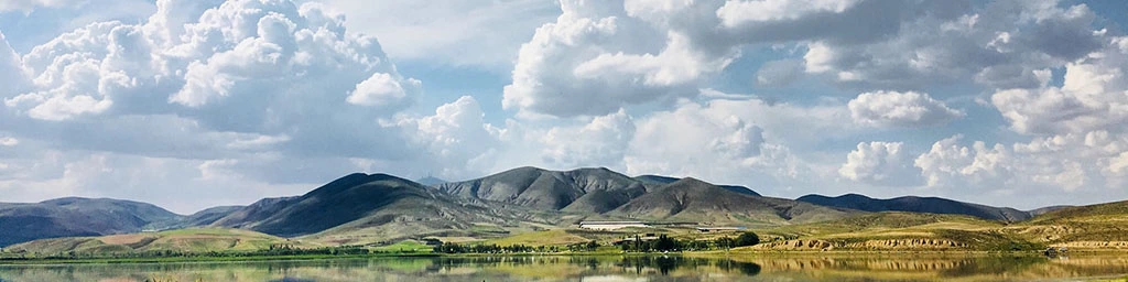 Mountains with large clouds gathering above them